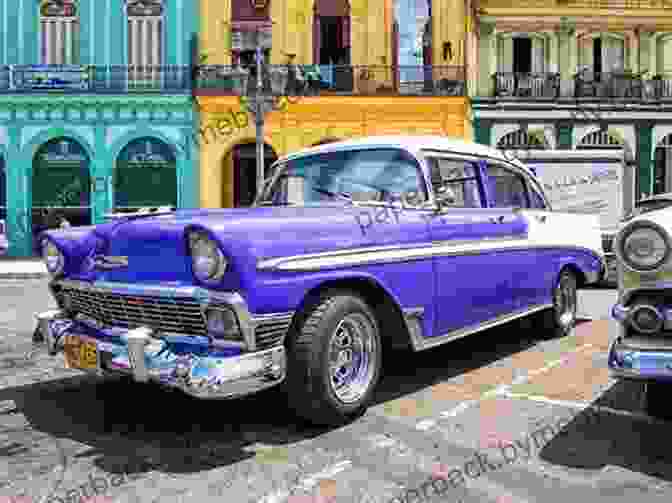 A Classic Chevrolet Bel Air Parked In Front Of A Colorful Building In Havana. Classic Cars In Cuba: Eastern Cuba: A Living Museum With A Plethora Of Old Cars In Everyday Use