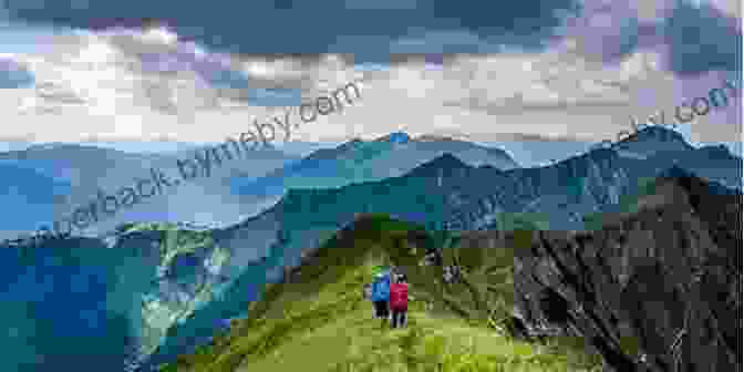 A Hiker Enjoys The Panoramic Views From Atop A Grassy Hill Overlooking A Rugged Coastline. The Coast To Coast Walk: St Bees To Robin Hood S Bay (Cicerone)