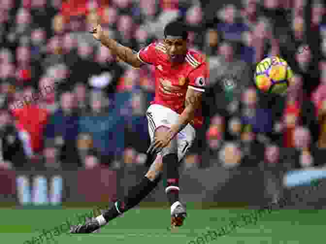 A Photo Of Marcus Rashford Playing Football With A Determined Expression. Marcus Rashford: Football Rising Stars