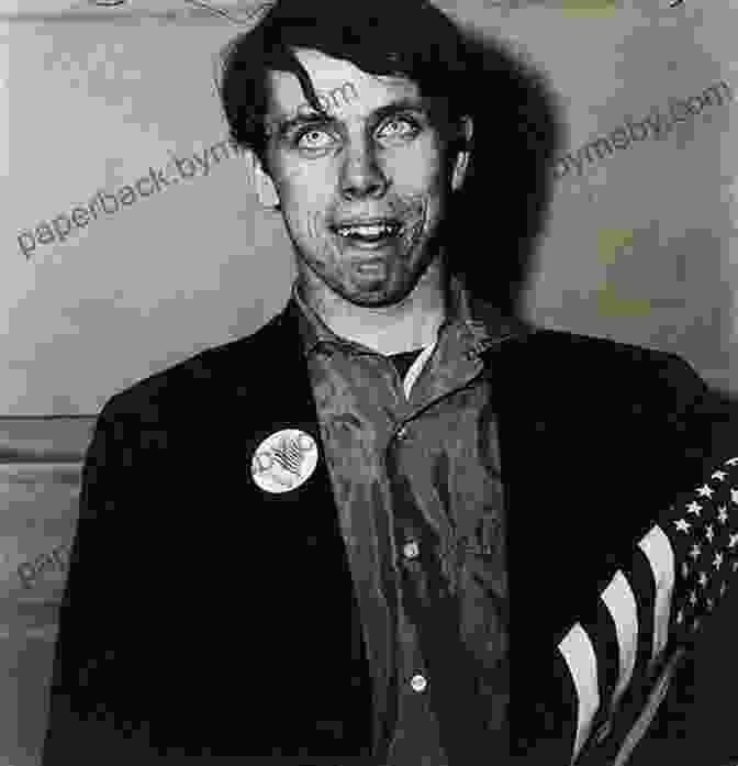 A Photograph By Diane Arbus Depicting A Young Man With His Hands Raised In Surrender The Sense Of Sight (Vintage International)