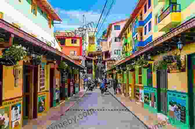 A Vibrant Street Scene In Medellín, Colombia, Known For Its Colorful Street Art And Lush Vegetation Colombia Travel Guide: The Top 10 Highlights In Colombia (Globetrotter Guide Books)