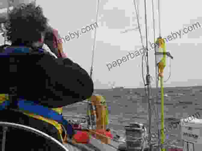 Crew Member Keeping Watch On The Horizon OCEAN NOMAD: The Complete Atlantic Sailing Crew Guide How To Catch A Sailboat Ride Contribute To A Healthier Ocean