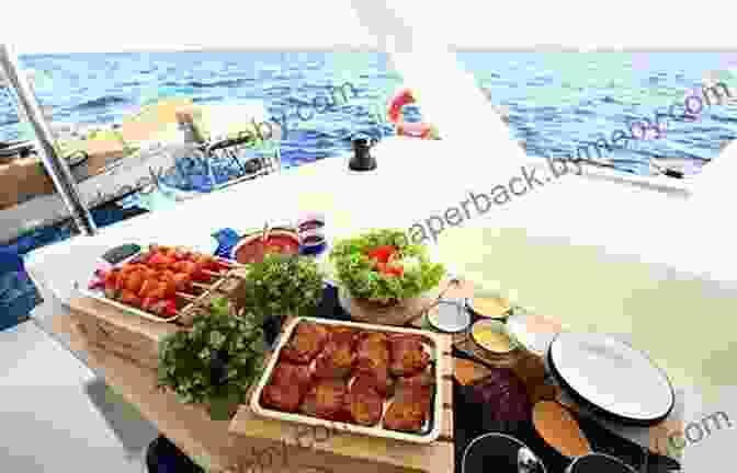 Crew Members Preparing A Meal On A Sailboat OCEAN NOMAD: The Complete Atlantic Sailing Crew Guide How To Catch A Sailboat Ride Contribute To A Healthier Ocean