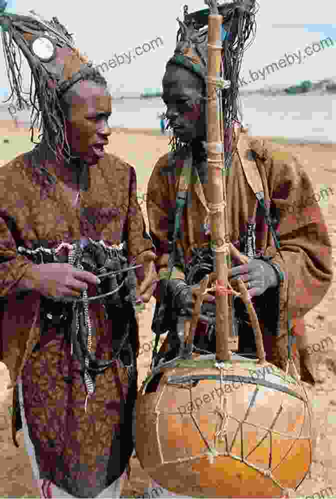 Kwame Listening To A Griot, A Traditional African Storyteller Kwame The Lion Boy