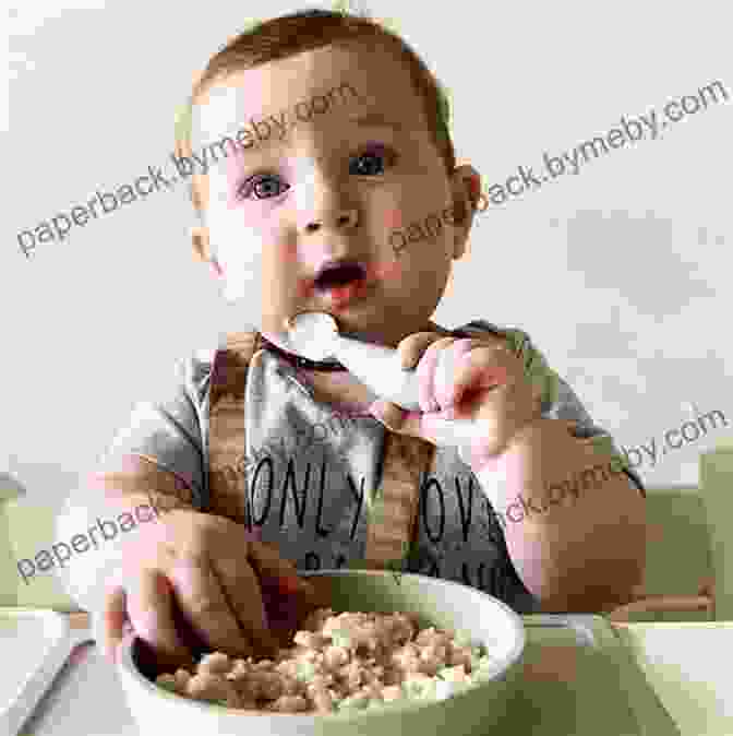 Smiling Baby Eating From A Spoon Responsive Feeding: The Baby First Guide To Stress Free Weaning Healthy Eating And Mealtime Bonding