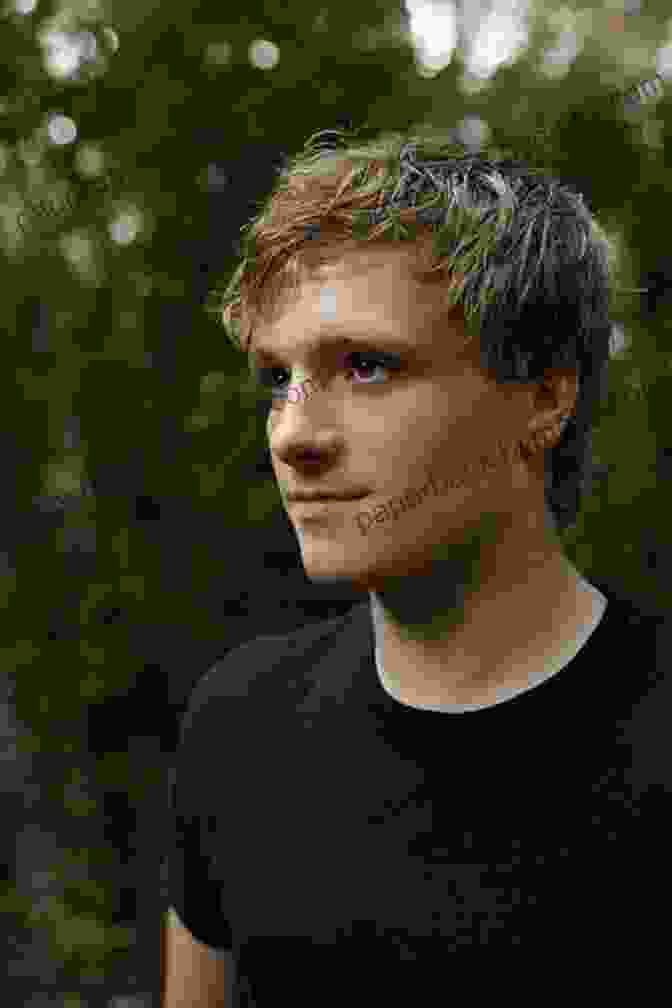 Young Man With Blond Hair And Gentle Expression, Peeta Mellark Guide To The Hunger Games: The World Of The Hunger Games